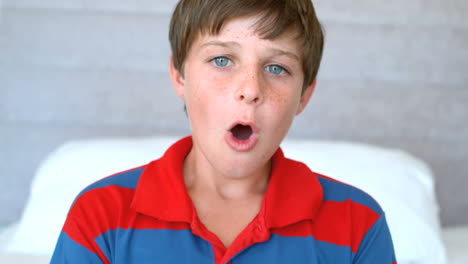 Frightened-boy-sitting-in-his-bed