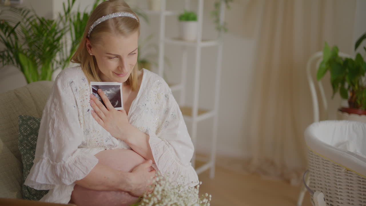 Pregnant Woman Holding Ultrasound Picture