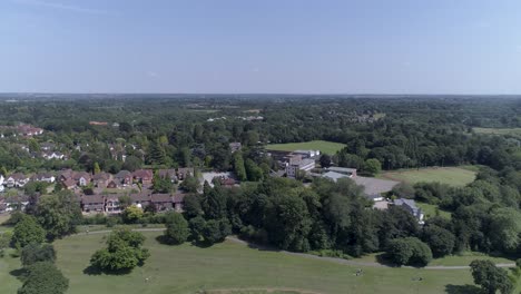 left to right aerial shot above park in solihull, birmingham, uk