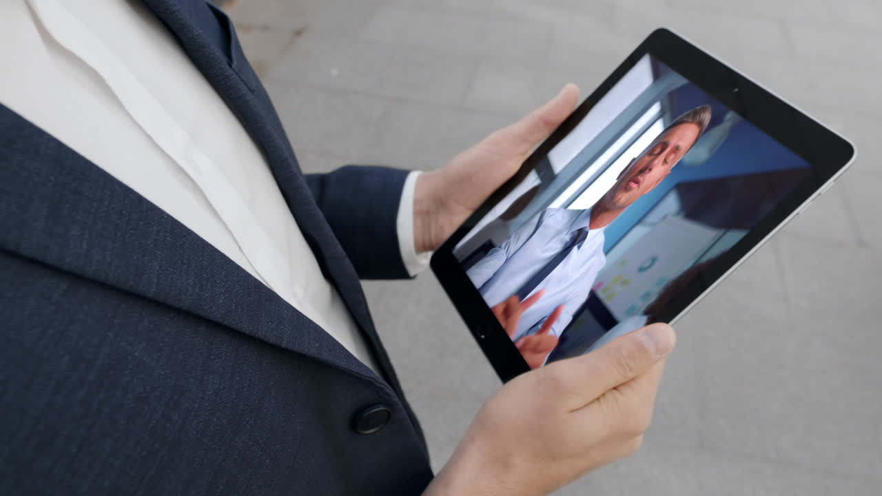 Director have video conversation with worker on street close up. Online call