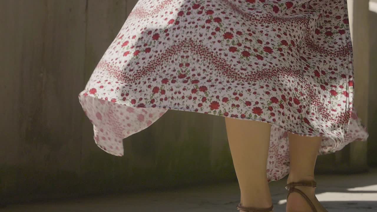 Woman Walking in Floral Dress