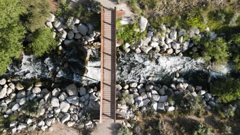 Top-View-Of-Rapids-Under-Small-Bridge-On-Bell-Canyon-Trail-In-Sandy-Utah,-USA