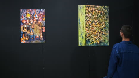 art exhibition with paintings of onions and other subjects