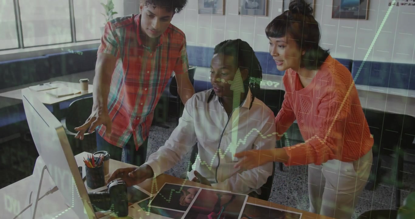 Design team clicking mouse grabbing DSLR pointing prints and selecting images during design review