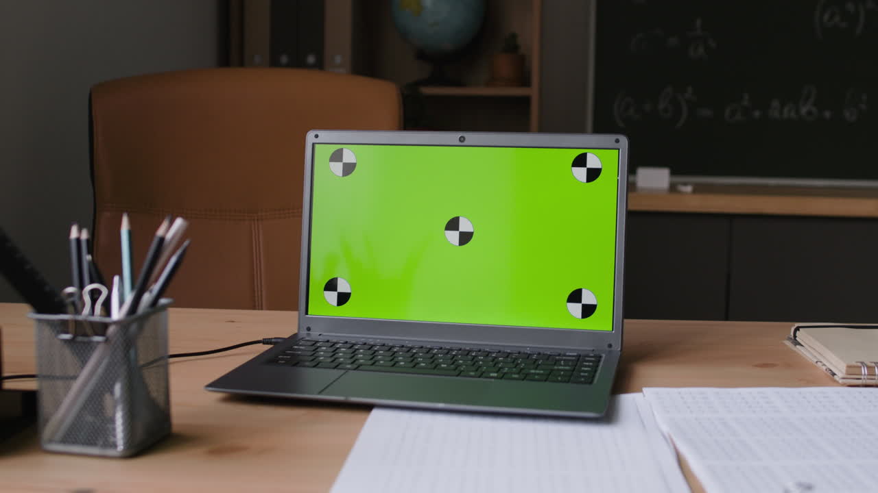 Laptop with Green Screen in Classroom Setting