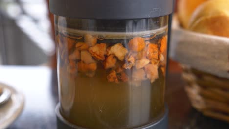 close-up of a glass jar filled with fruit tea infusion