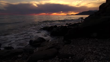 dramatic mediterranean romance: sunset's orange dusk paints the sky and sea surface - a mesmerizing coastal evening