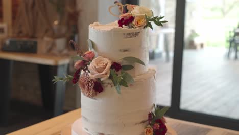 wedding cake decorated with cream and autumn flowers. a traditional dessert that the newlyweds cut together. europe, czech republic