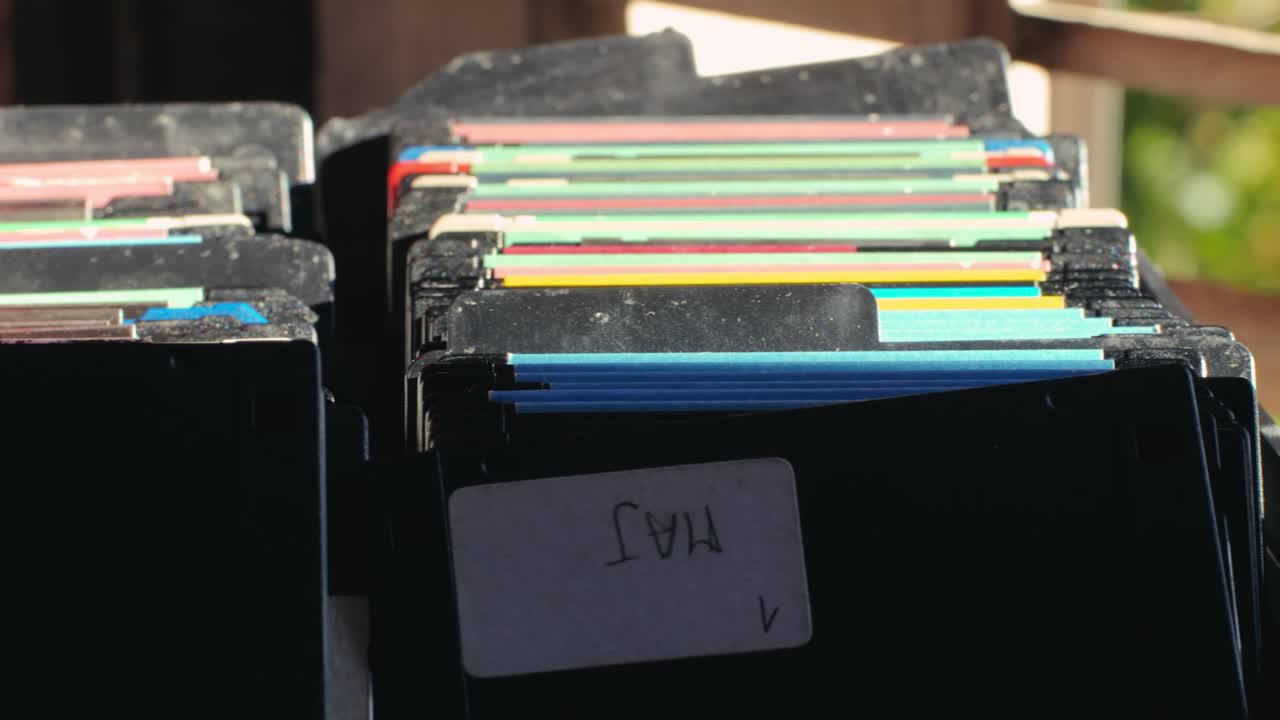 Using diskette for old computer. Music recorder, playing retro computer games. Vintage device for office, obsolete technology. . High quality 4k footage