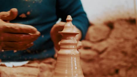 close-up-of-artisan-hands-Throwing-clay-on-potter’s-wheel