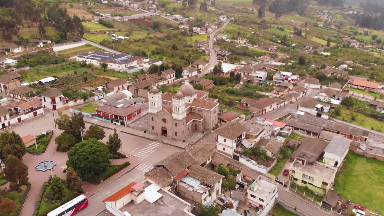 Aerial Orbital Shot with Views of Iglesia Cat&oacute;lica Church in San Antonio de Pasa, Ecuador
