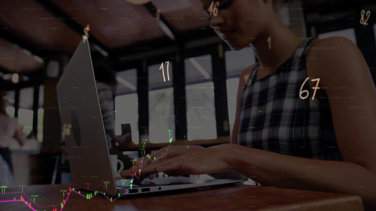 Animation of financial data processing over woman using laptop