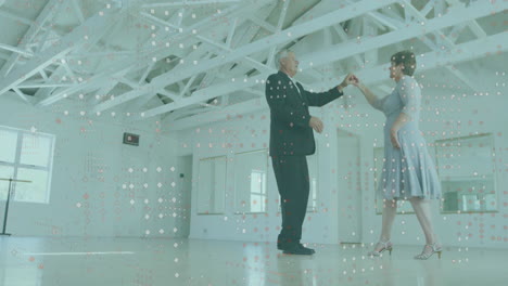 elderly couple dancing in bright room with digital data animation overlay