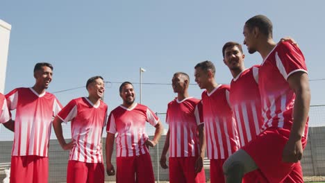 soccer players standing on field