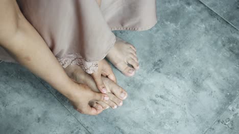 close up on women feet and hand massage on injury spot