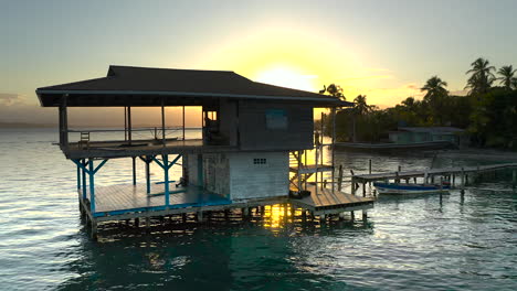 aerial: drone panama bocas del toro boat house sunset