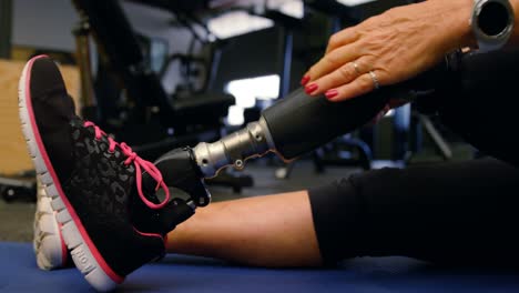 senior woman stretching in fitness studio 4k