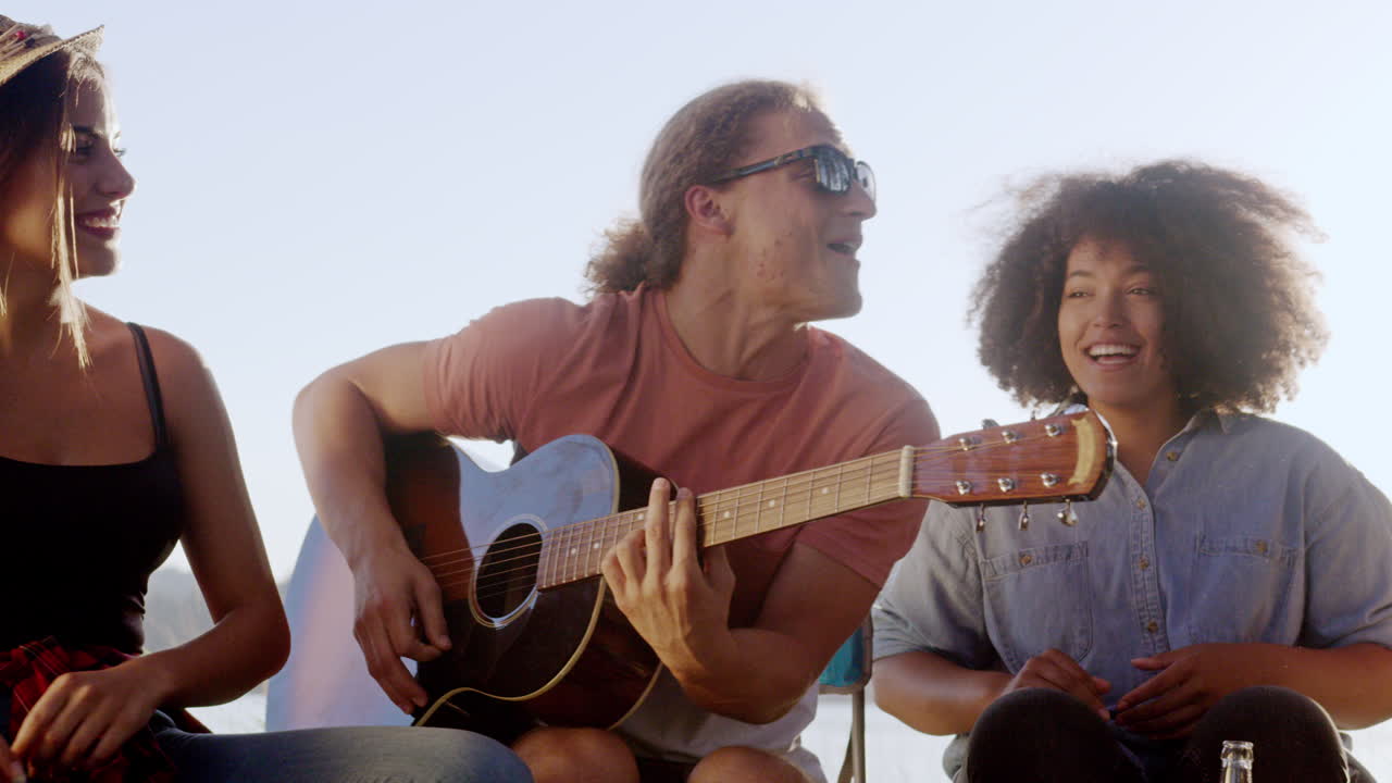 Friends Enjoying A Sunny Day With Music