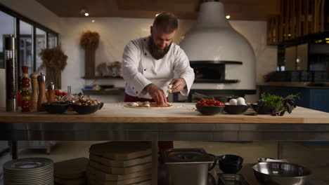 pizza chef man cooking italian dinner recipe in kitchen. baker put mozzarella.