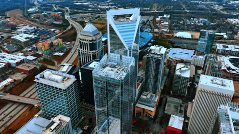group of skyscrapers and highway system of metropolis at daytime. top view of charlotte, nc, usa