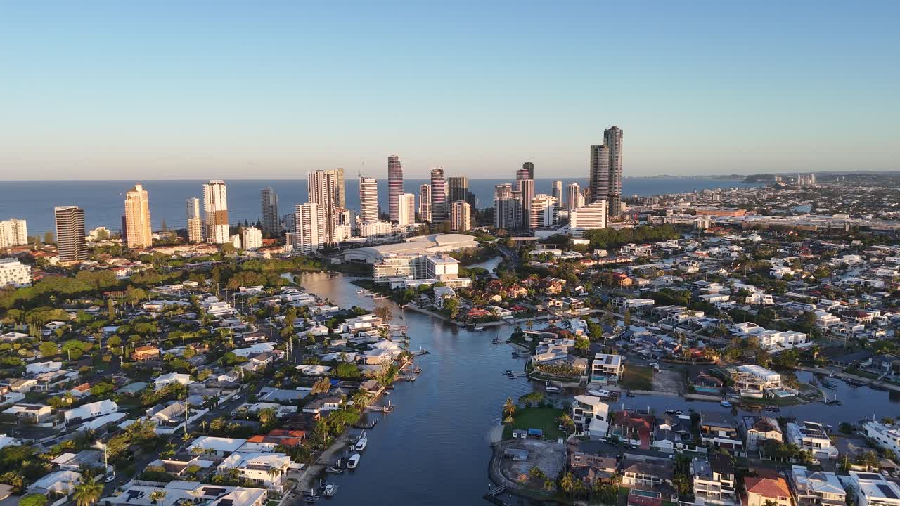 Drone footage captures Gold Coast&#x27;s skyline and waterways during sunset, highlighting urban architecture and natural beauty