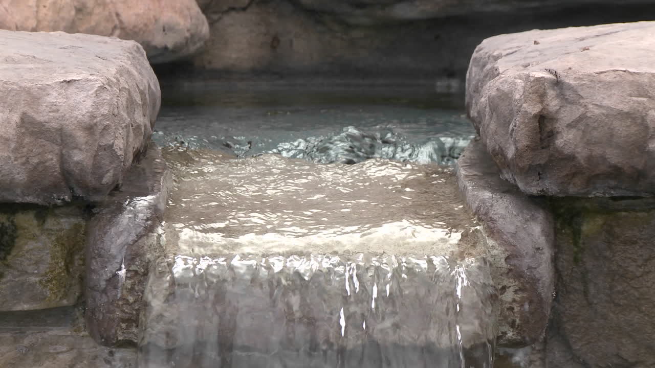 Tilt down of water in a fountain in Oak View California