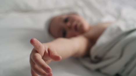 Close-up-of-hands-of-cute-caucasian-baby-after-the-bath.