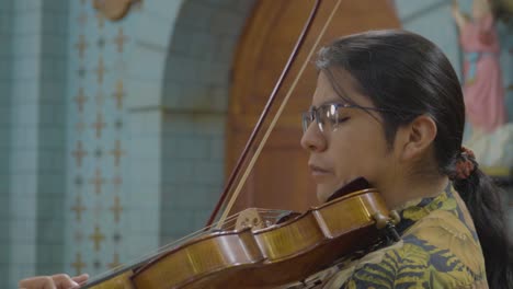 male musician playing on a violin