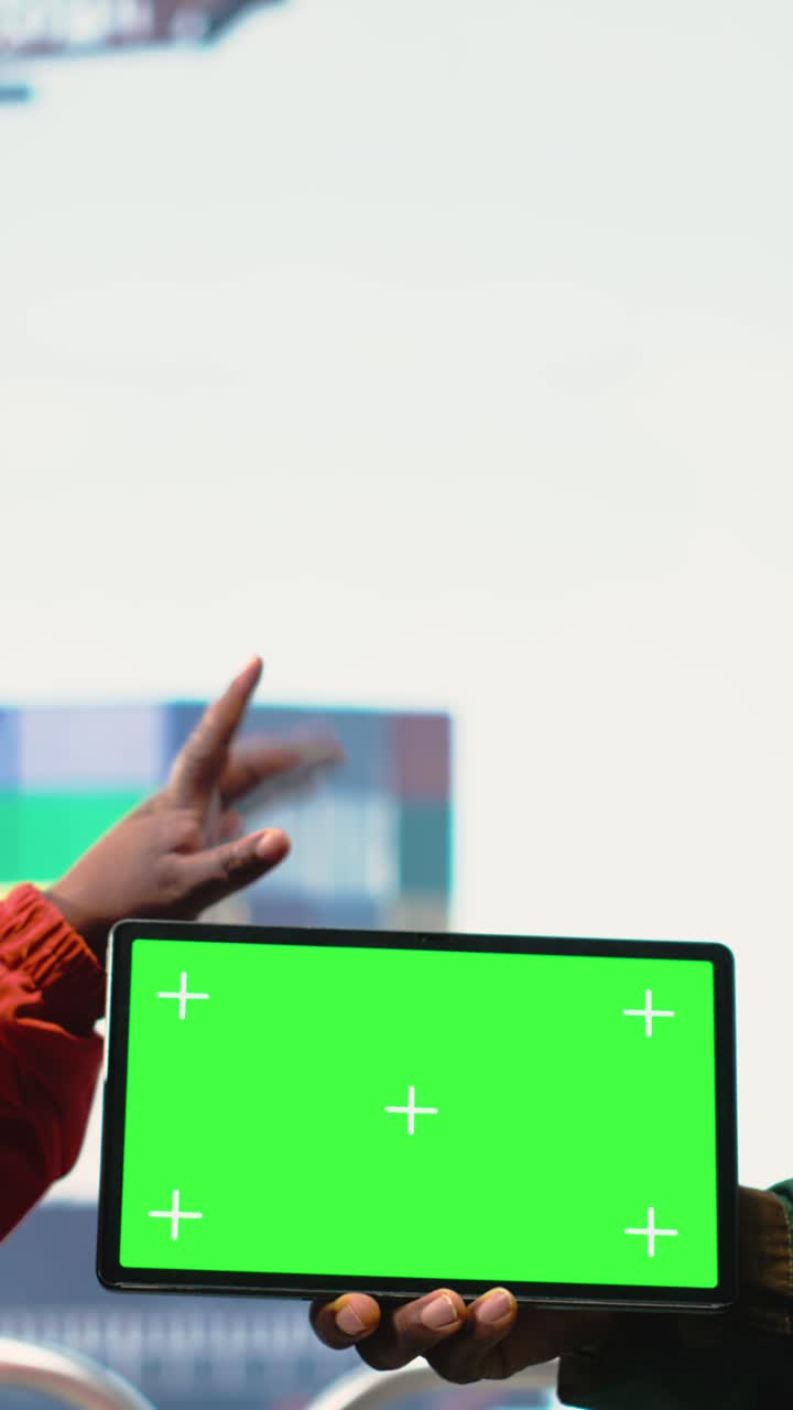 Vertical video Chroma key tablet used by soldier on offshore platform deck