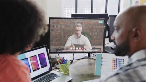 african american business people on video call with caucasian male colleague on screen