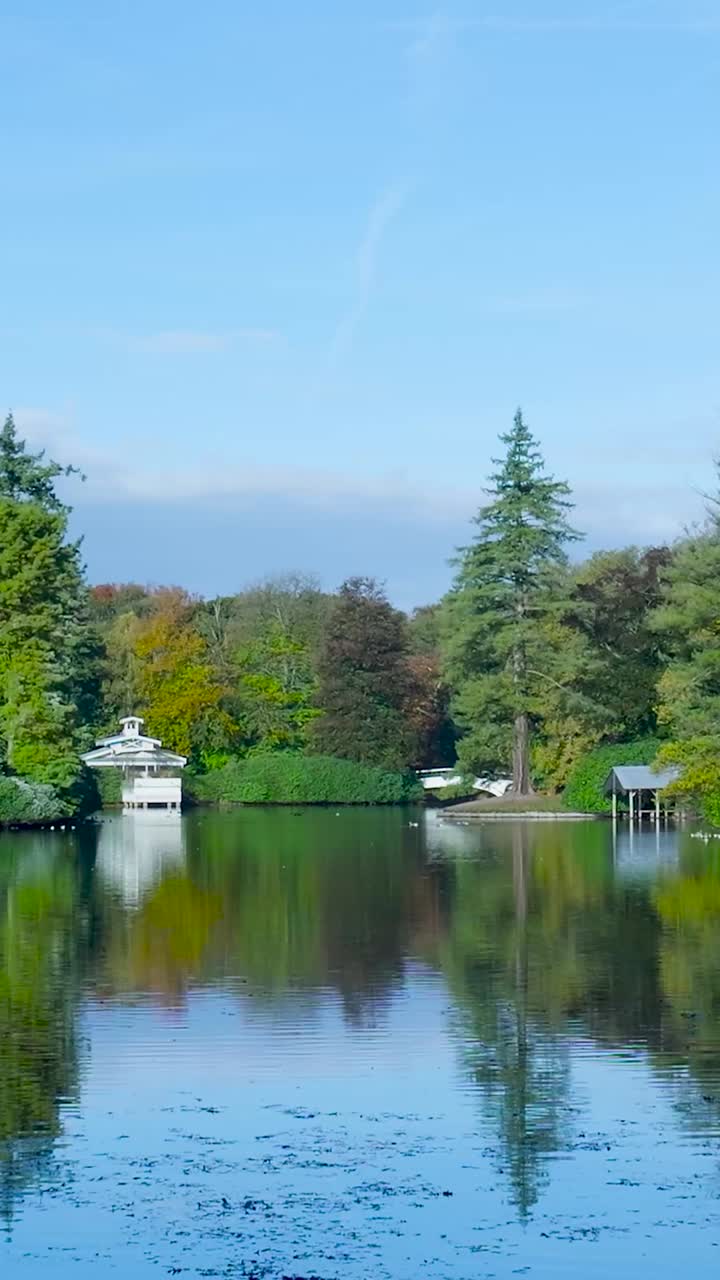 Scenic Lake Landscape with Boathouse and Reflections