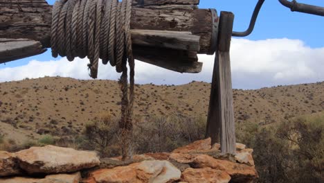 hand dug well in a western town in 4k resolution in slow motion