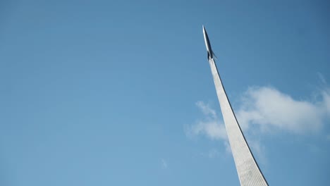 rocket monument against a clear blue sky