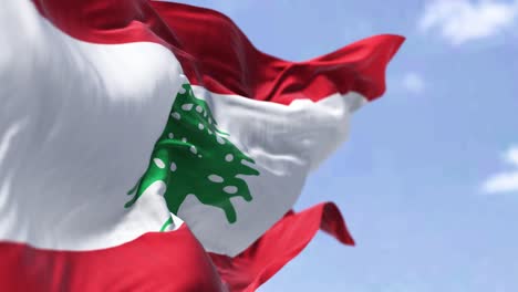 detail of the national flag of lebanon waving in the wind on a clear day