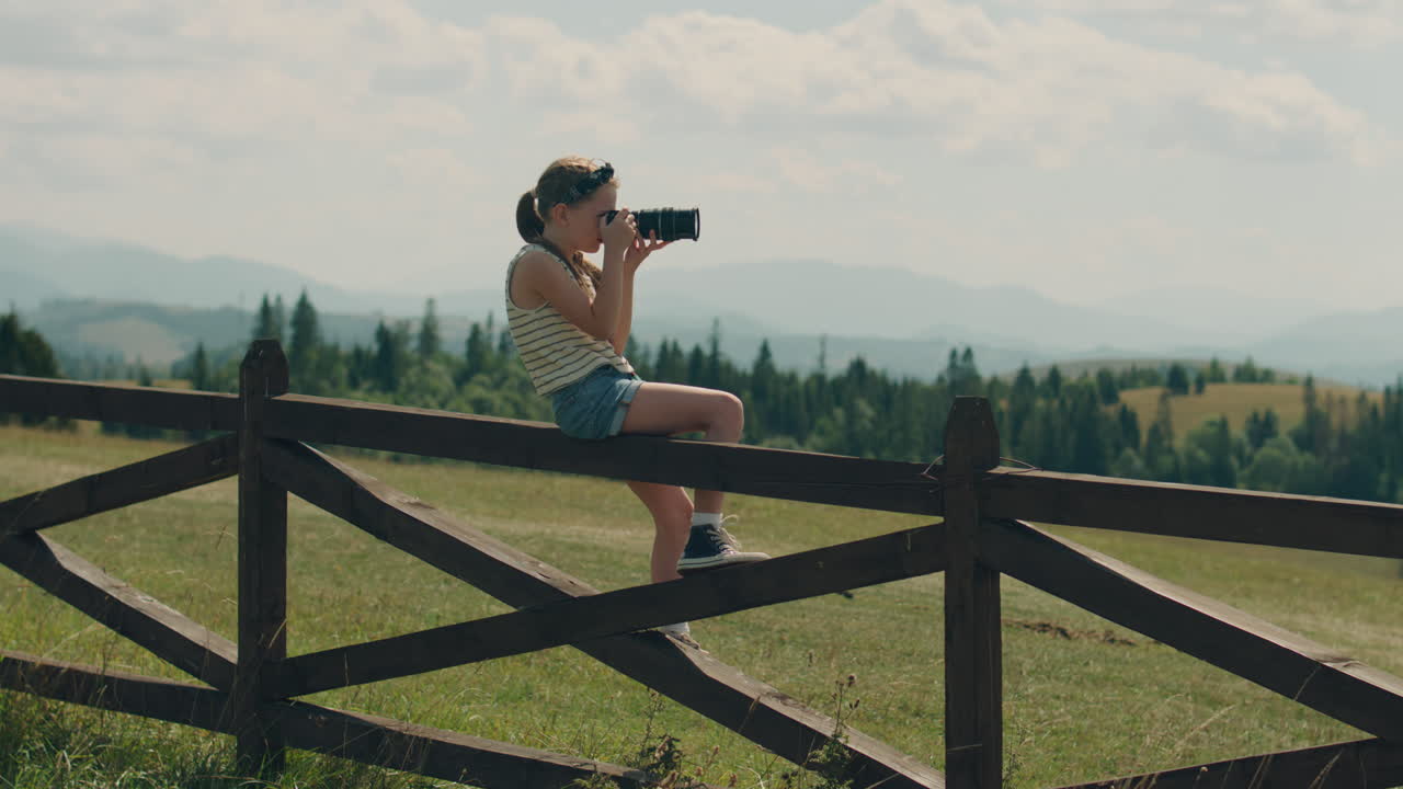 Young Girl Photographer Shooting Landscape Young Photographer Shooting Landscape on Beautifull Green Hillway Taking Pictures of Nature Girl Filling the Portfolio with Amazing Photos Spending Leisure Time Outdoor Slow Motion