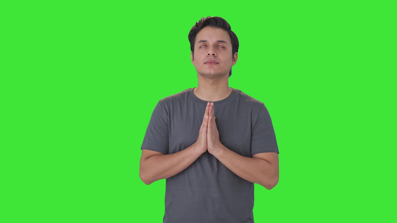 Religious Indian man praying to God Green screen
