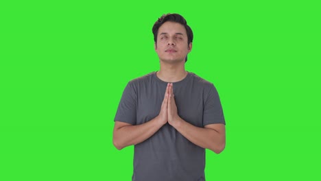 religious indian man praying to god green screen