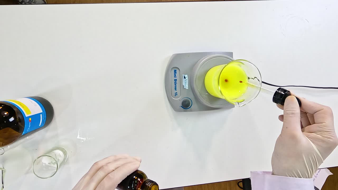 A laboratory experiment demonstrating the iodine clock reaction with precise chemical mixing and color change observation
