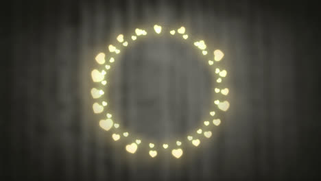 Glowing-circle-of-fairy-lights-on-grey-background