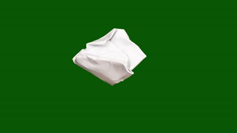 torn white rectangle on green background