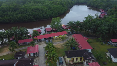 drone view of houses village near river in rompin pahang, malaysia