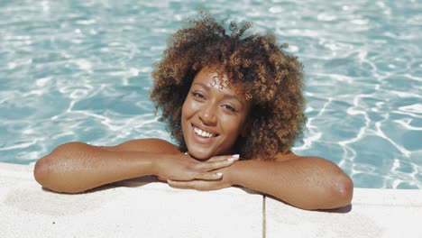 young girl posing in water of pool