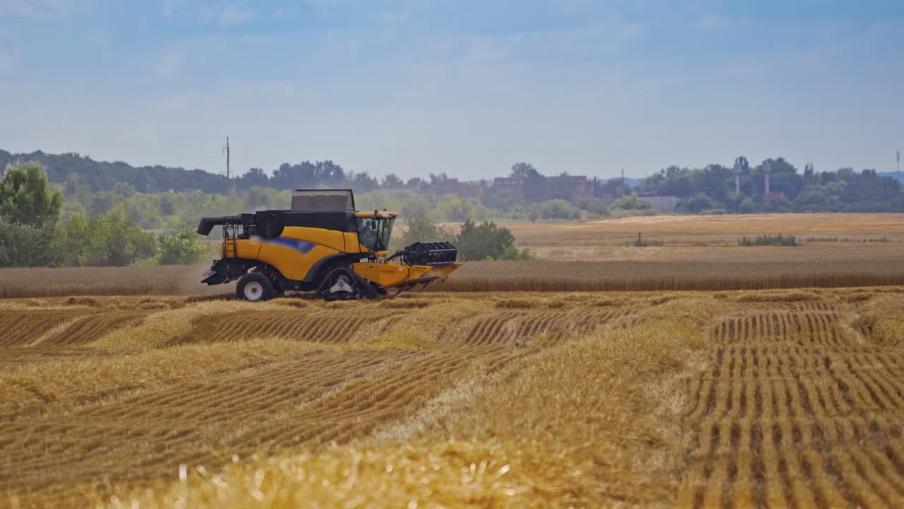 Modern combine harvester on the field. Agricultural machine in the rural place at seasonal works. Food industry concept.