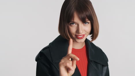 young woman waving finger and saying no