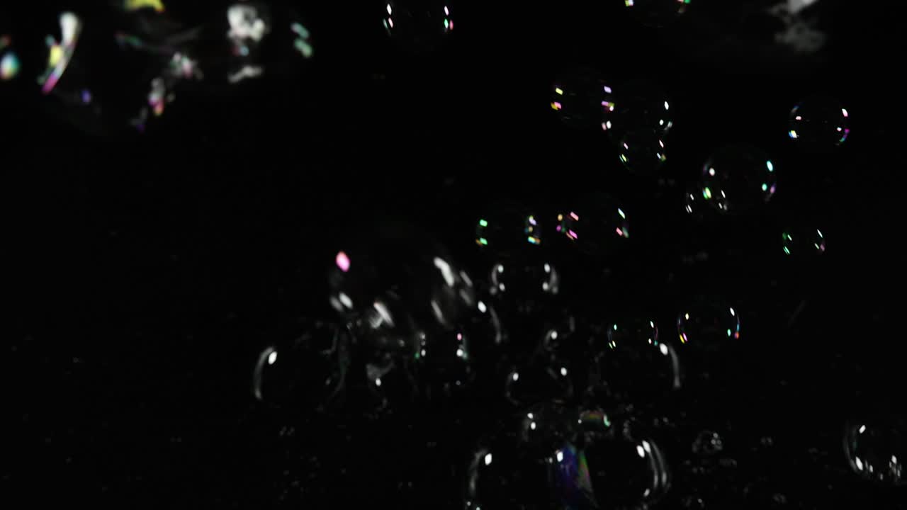 A captivating display of bubbles floating in darkness