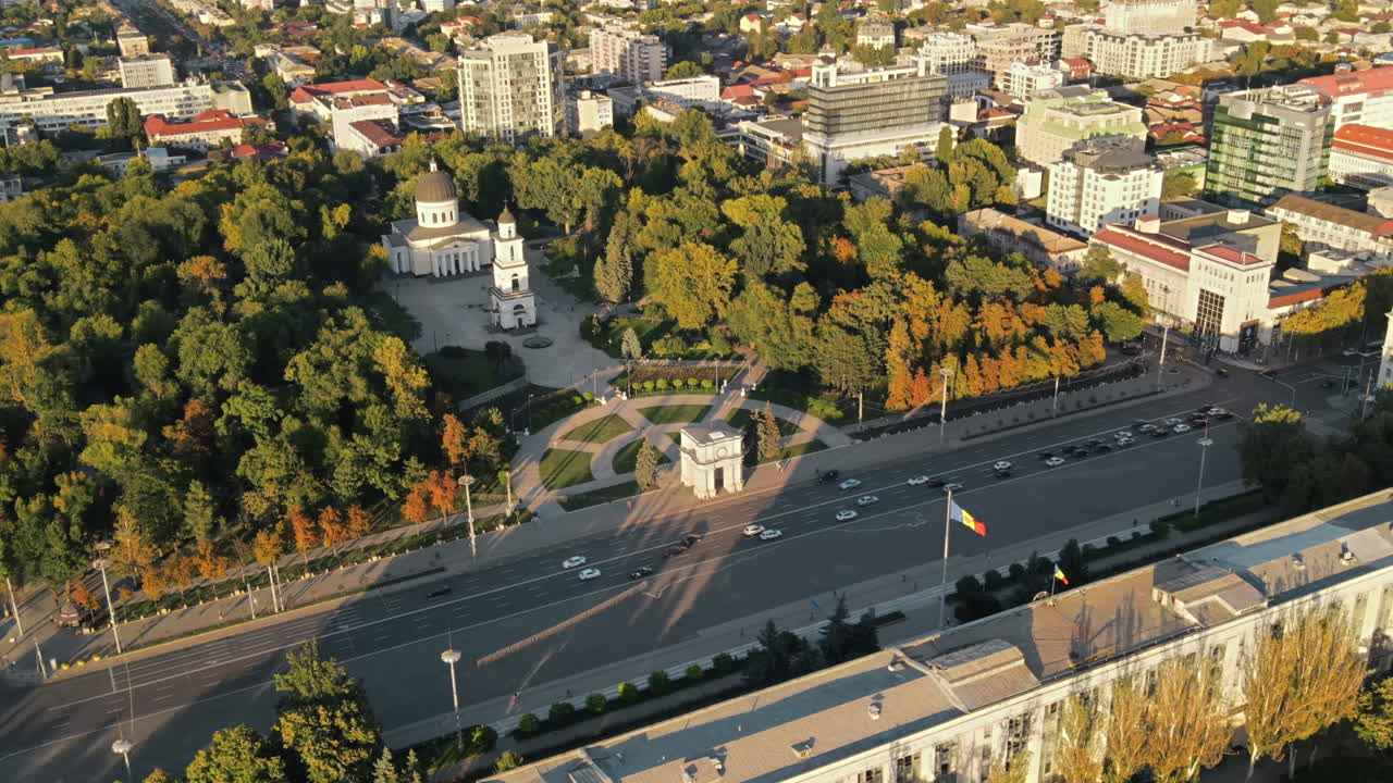 Aerial drone view of Chisinau downtown at sunset. Panorama view of Central Park, Cathedral, Goverment a lot of greenery, buildings. Moldova