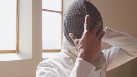 fencer athlete during a fencing training in a gym