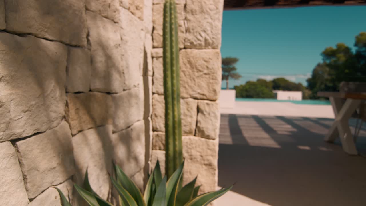 exterior mediterranean stone villa wall with cactus
