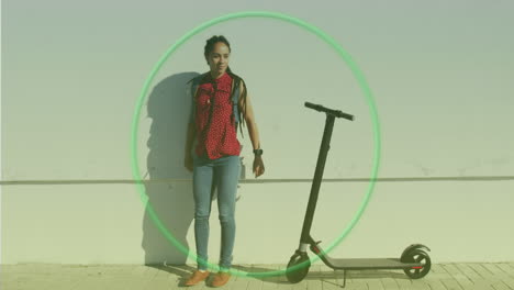 neon green circle against african american woman with electric scooter standing by the street