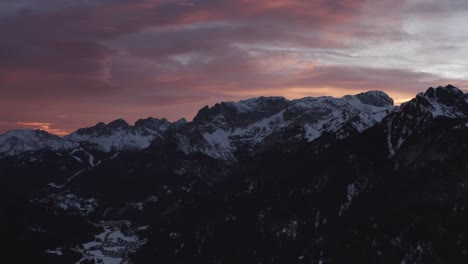 snowy alpine village at sunset